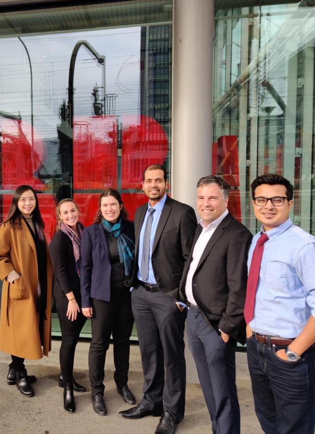 multiple people standing in front of ABB building