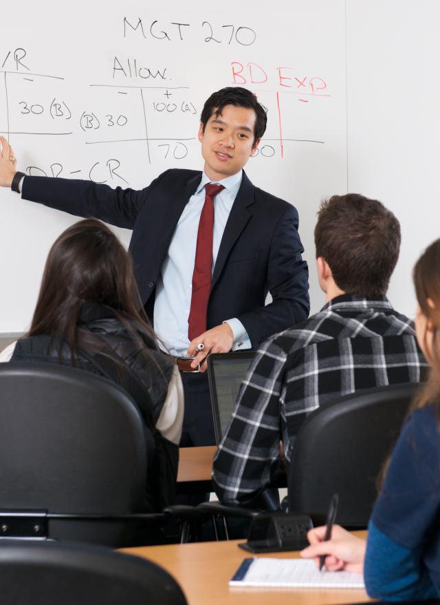 Accounting Professor Paul Wong teaching MPAc class