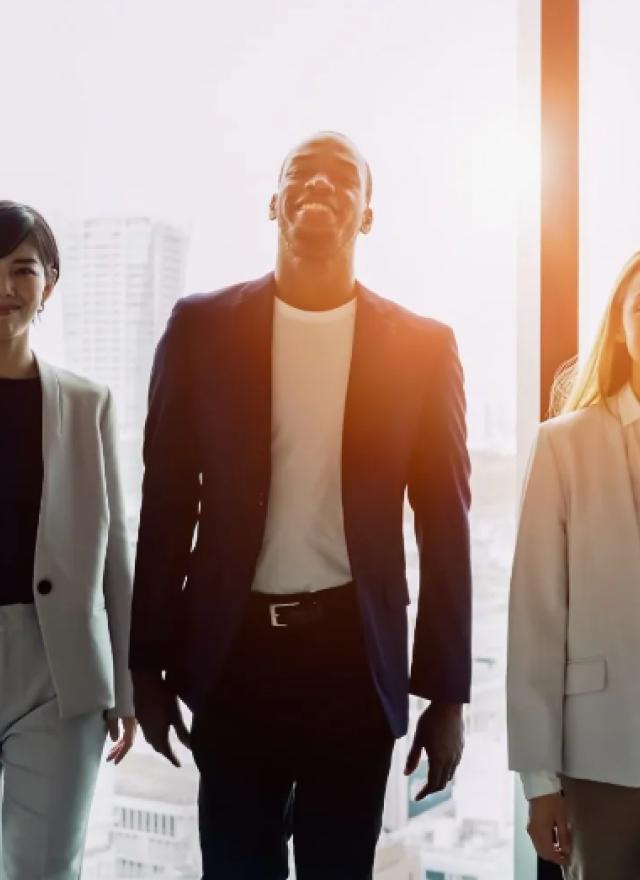 a trio of diverse professionals in an office setting