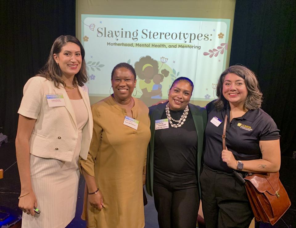 Leticia Garay standing with Alex Svensson and two guests from her panel