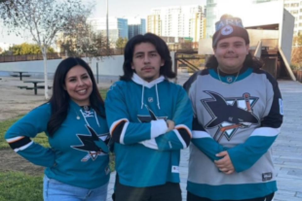 Regina Saldana with her two sons wearing San Jose Sharks jerseys