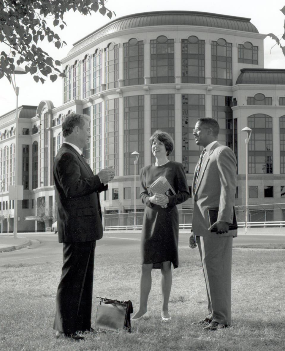 Dean Robert Smiley talking with students outside of One Capital Mall