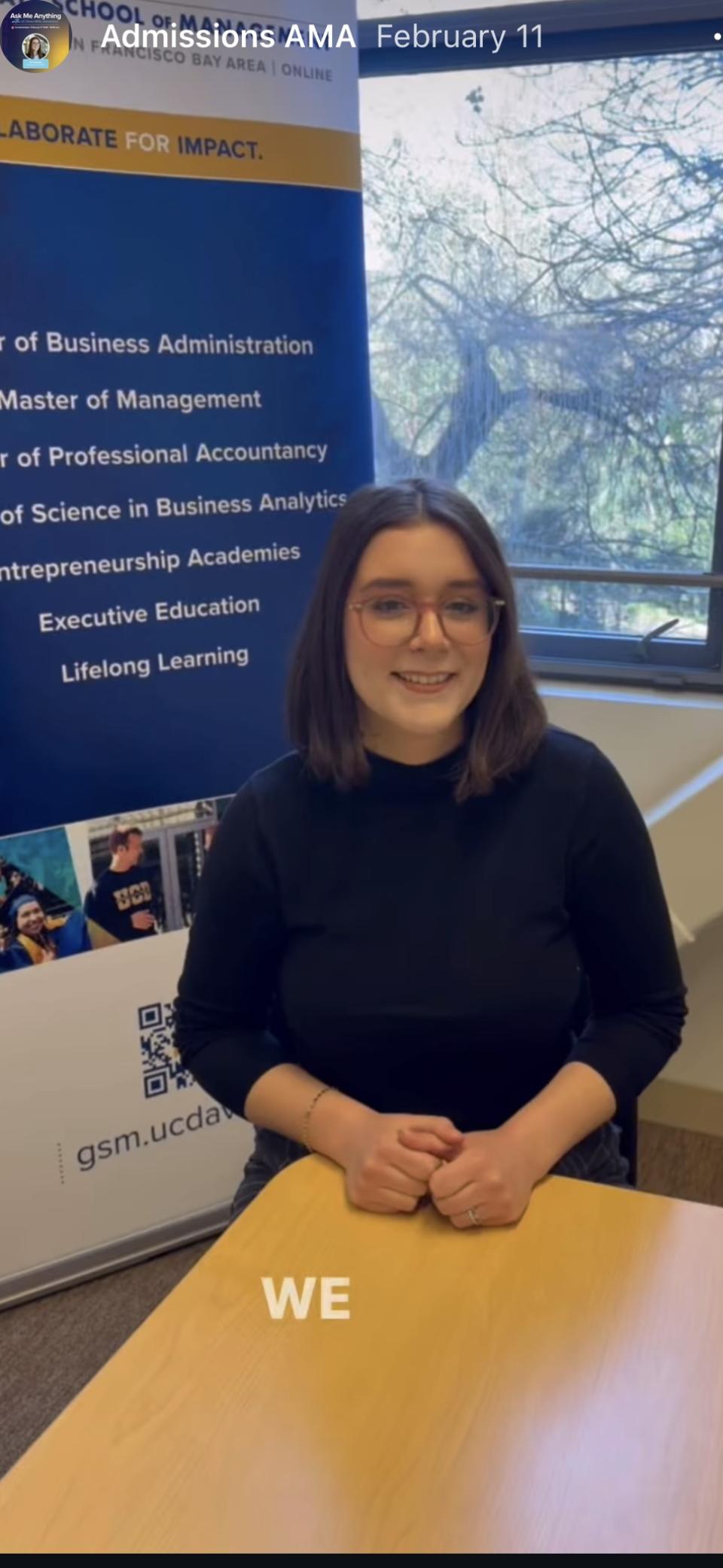 Zoe Dybdahl sitting in a conference room in Gallagher Hall, smiling at camera